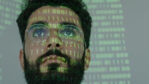 Employee with pixelated data on face to depict importance of online identity verification before hiring remote employees