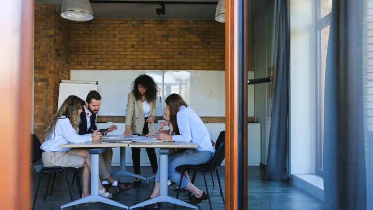 Happy collaborative team at workplace to show how technology is revolutionizing recruitment