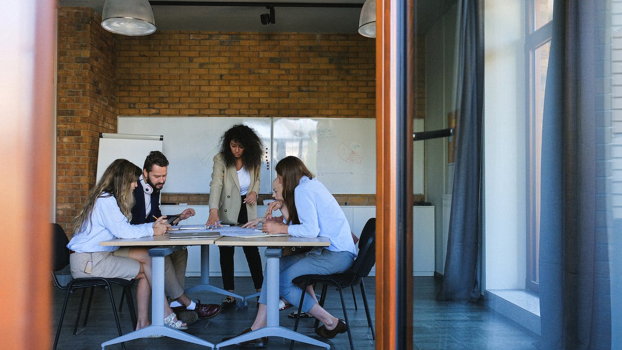 Happy collaborative team at workplace to show how technology is revolutionizing recruitment