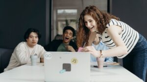 Remote employee joining meeting on laptop to show ultimate guide to hiring remote employees