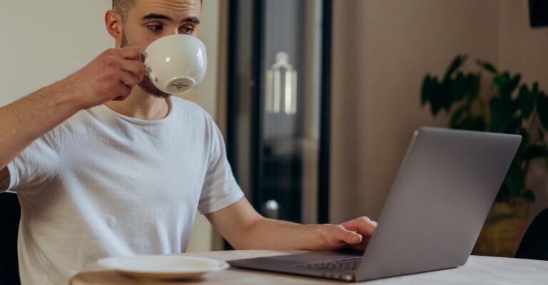 Recruiter at laptop reading the 2023 background screening trends