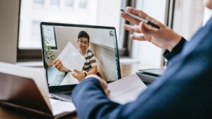 Hiring manager and remote candidate showing how to hire faster to impress candidates