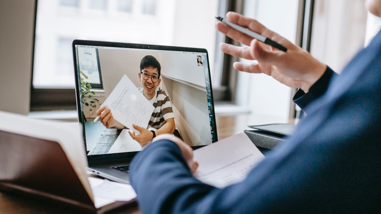 Hiring manager and remote candidate showing how to hire faster to impress candidates