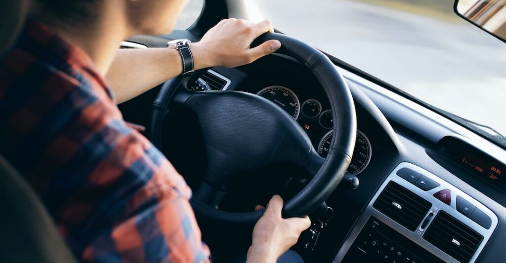 Male driver driving with a clean driver's abstract in Ontario