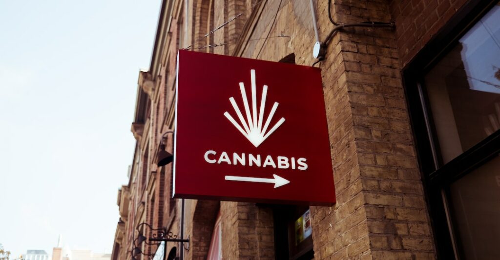 Cannabis store sign requiring cannabis industry and criminal record checks