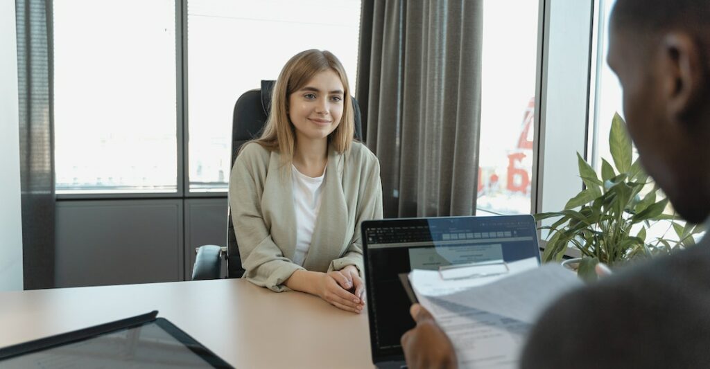 Female candidate interviewing for job who followed run a background check on yourself steps