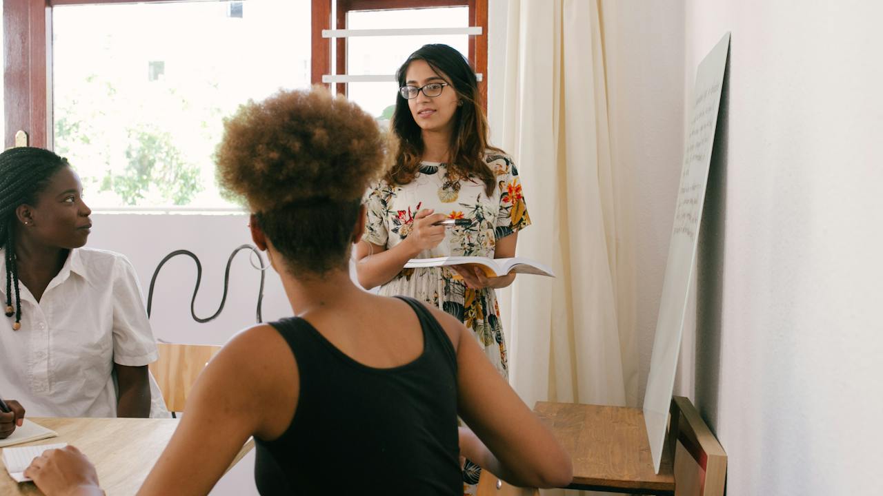 Diverse Coworkers Collaborating in Meeting in Safe Environment Due to Background Checks
