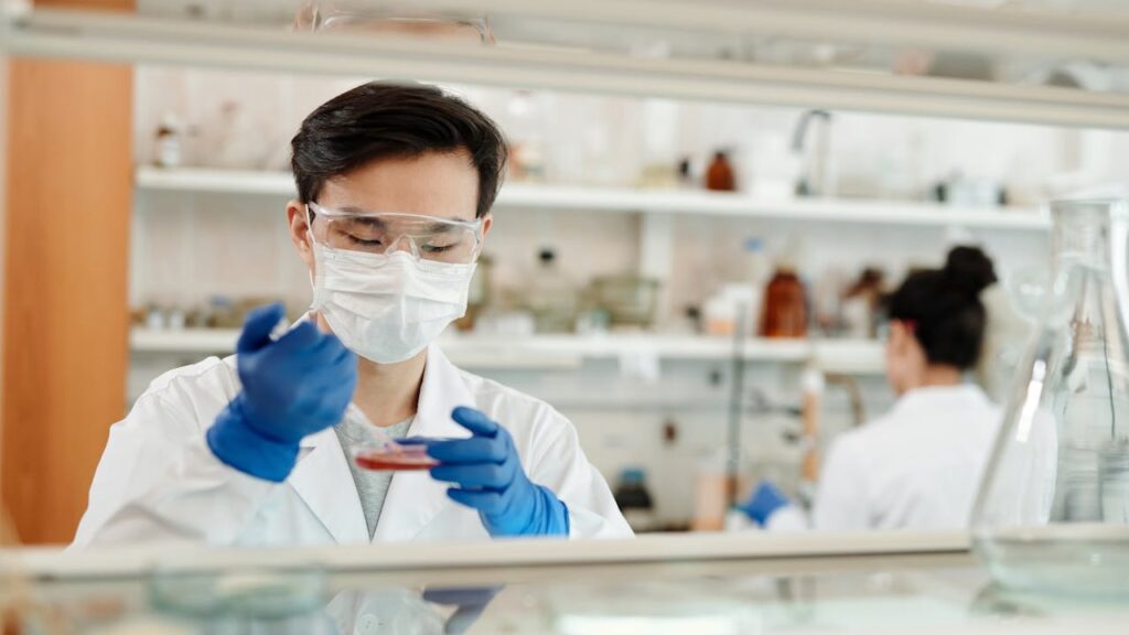 Lab technician mixing sample authorized to work with background checks for healthcare workers