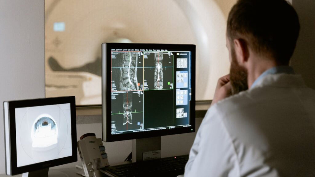 X ray technician reviewing CT scan authorized to work with background checks for healthcare workers