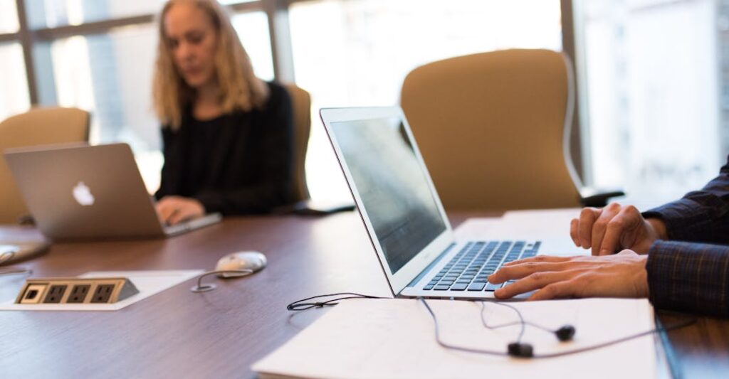 Coworkers in a boardroom depicting the best background checks for staffing agencies