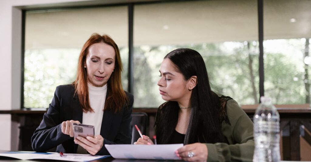 Business transaction between two women done using verifiable credentials in digital wallet
