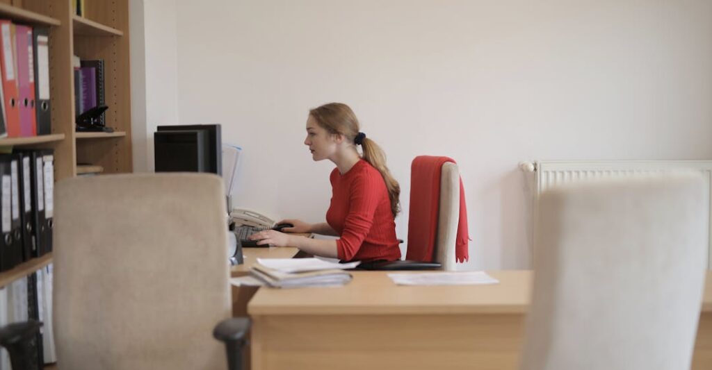 Municipal government clerk working at desk in office representing background check for government employment