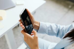 Closeup of woman taking a selfie for identity verification