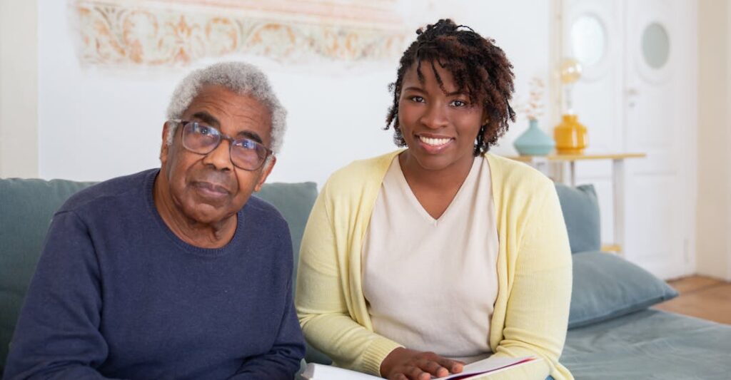 Care worker at a care home helping elderly resident with background checks for care workers