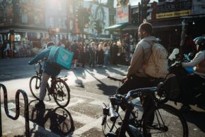 Deliveroo gig worker on bike in London, England vetted with new Right to Work checks